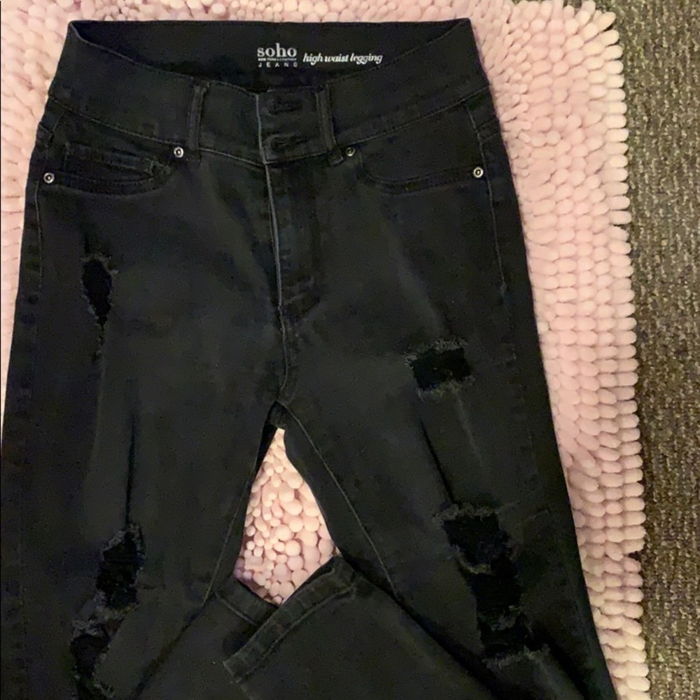 All black distressed jeans.